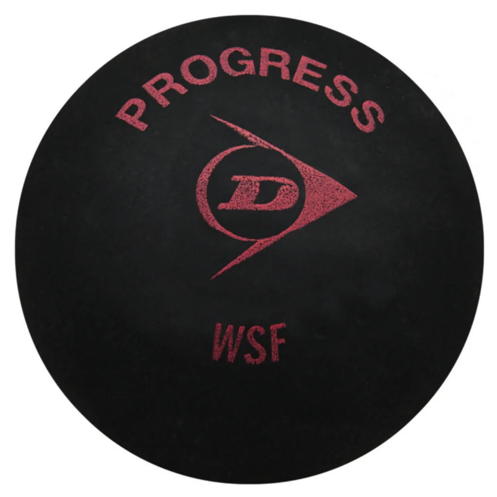 Close-up of Dunlop Progress squash ball, 6% larger, 20% longer hang time, highlighting N-1SR tech and textured rubber.